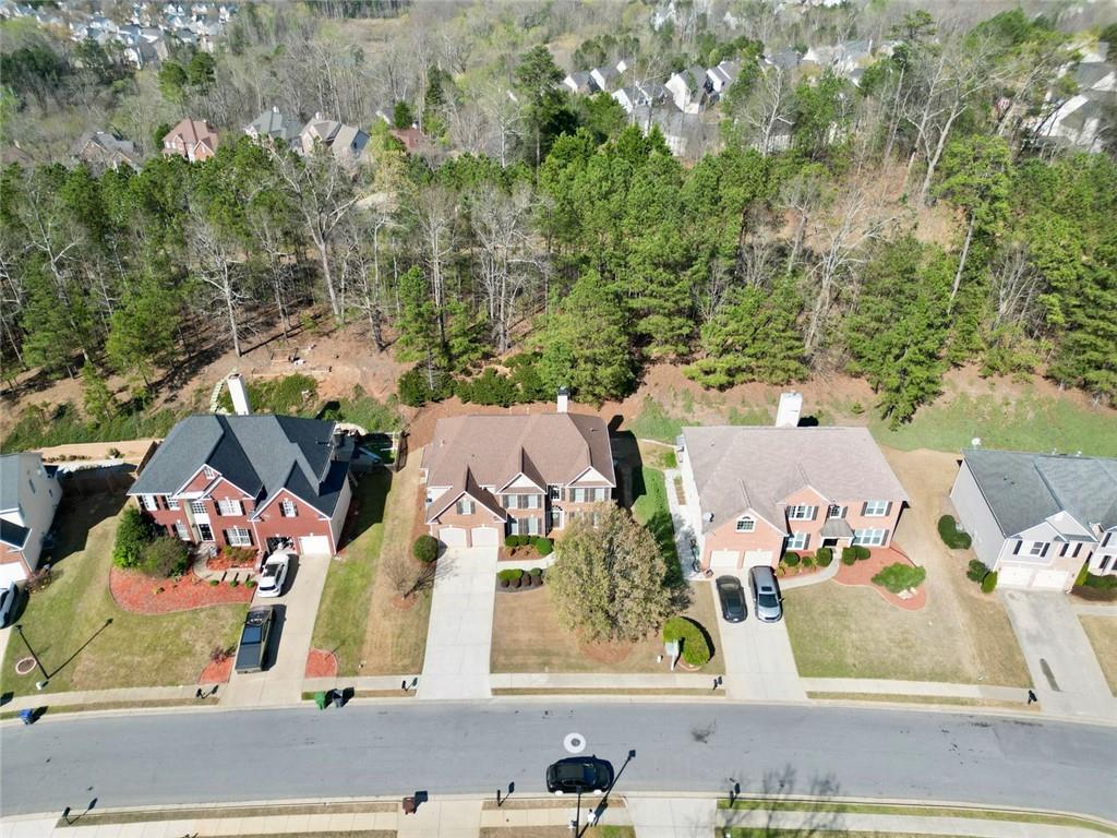 3945 Summit Gate Drive Suwanee, GA 30024 - Photo 2 of 45 an aerial view of residential houses with outdoor space
