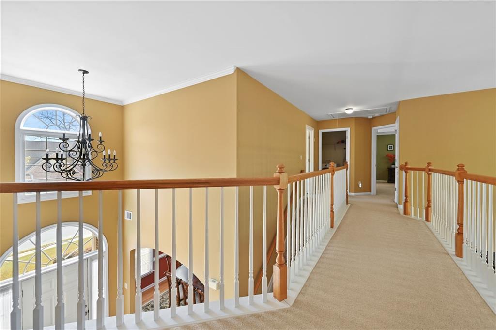 3945 Summit Gate Drive Suwanee, GA 30024 - Photo 29 of 45 a view of a hallway to rooms