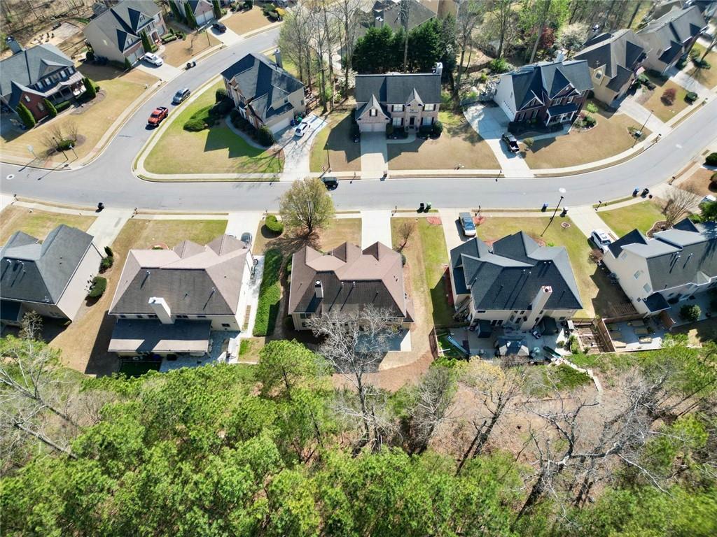 3945 Summit Gate Drive Suwanee, GA 30024 - Photo 3 of 45 an aerial view of residential houses with outdoor space