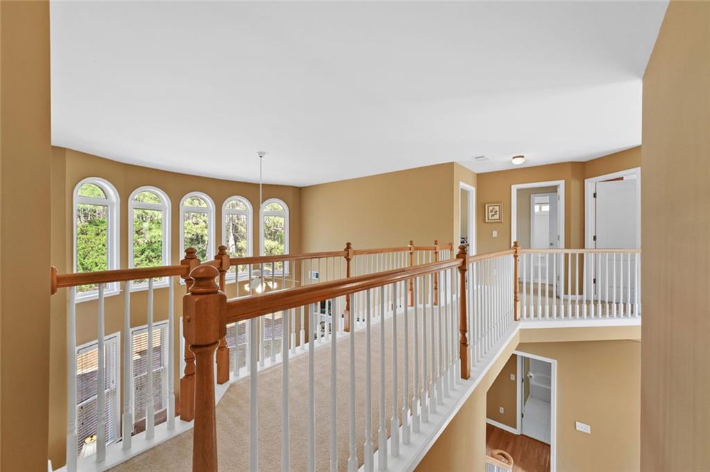 3945 Summit Gate Drive Suwanee, GA 30024 - Photo 36 of 45 a view of entryway with wooden floor