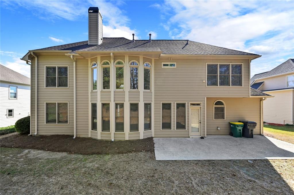 3945 Summit Gate Drive Suwanee, GA 30024 - Photo 44 of 45 a front view of a house with a yard