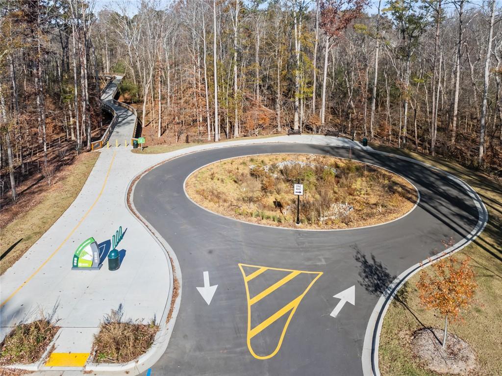 3945 Summit Gate Drive Suwanee, GA 30024 - Photo 7 of 45 a view of a swimming pool with outdoor seating and plants