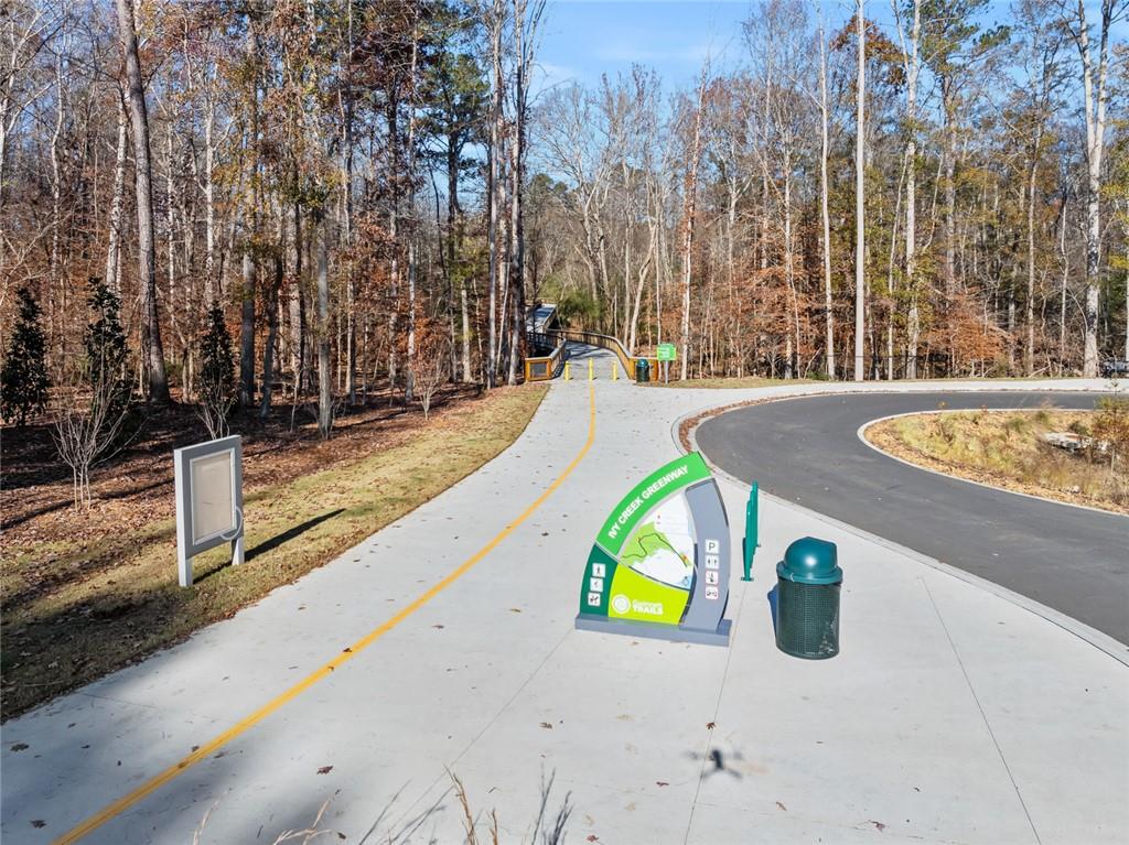 3945 Summit Gate Drive Suwanee, GA 30024 - Photo 8 of 45 a view of a swimming pool with a patio