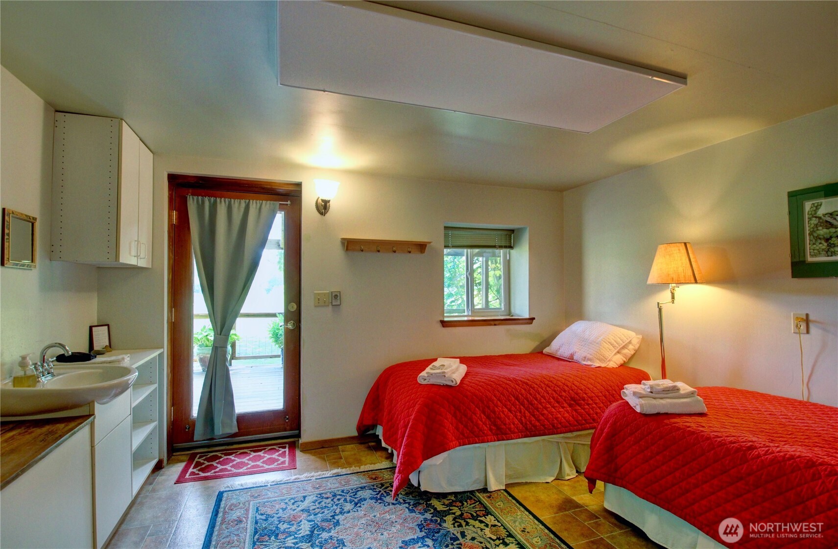 31459 Barben Road Sedro-Woolley, WA 98284 - Photo 11 of 32 a bedroom with a bed and a dresser next to a window