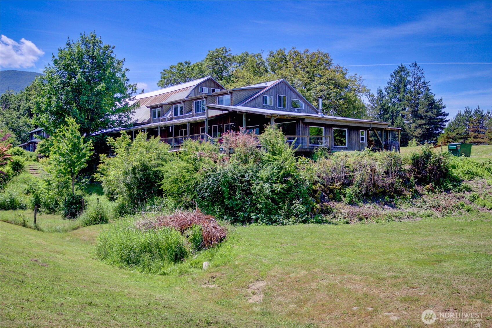 31459 Barben Road Sedro-Woolley, WA 98284 - Photo 2 of 32 a front view of a house with a yard
