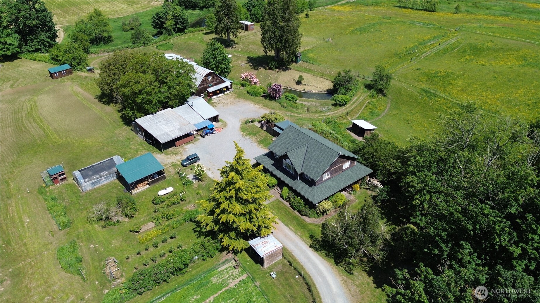 31459 Barben Road Sedro-Woolley, WA 98284 - Photo 28 of 32 an aerial view of a house with a yard basket ball court and outdoor seating
