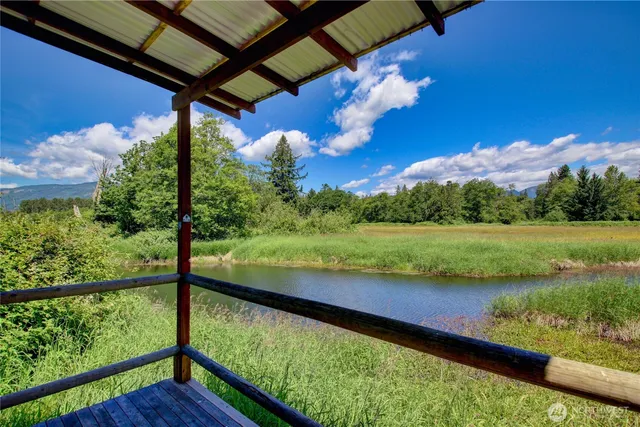 a view of a lake with a yard