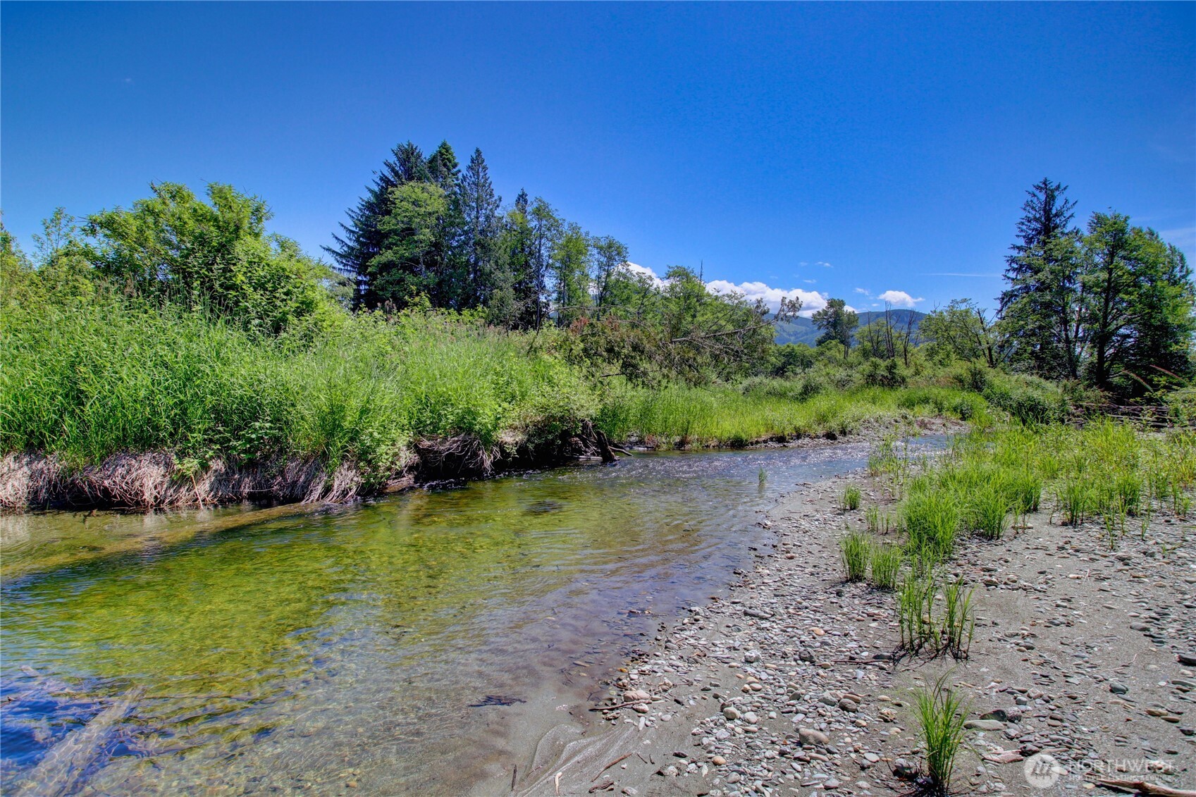31459 Barben Road Sedro-Woolley, WA 98284 - Photo 30 of 32 a view of a lake with a yard