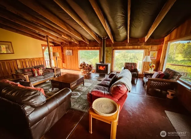 a view of balcony with wooden floor and outdoor seating