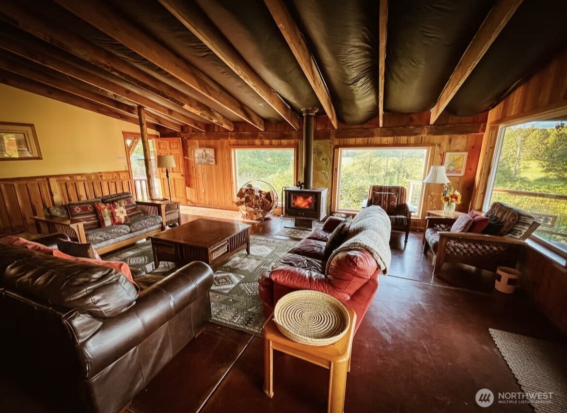 31459 Barben Road Sedro-Woolley, WA 98284 - Photo 8 of 32 a living room with furniture a couch and large windows