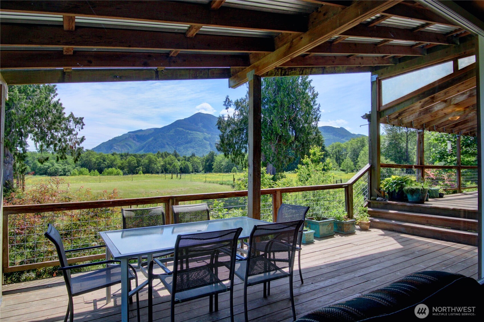 31459 Barben Road Sedro-Woolley, WA 98284 - Photo 9 of 32 a view of balcony with wooden floor and outdoor seating