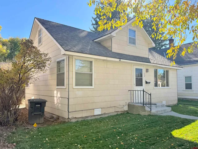 a view of backyard with a garden and deck