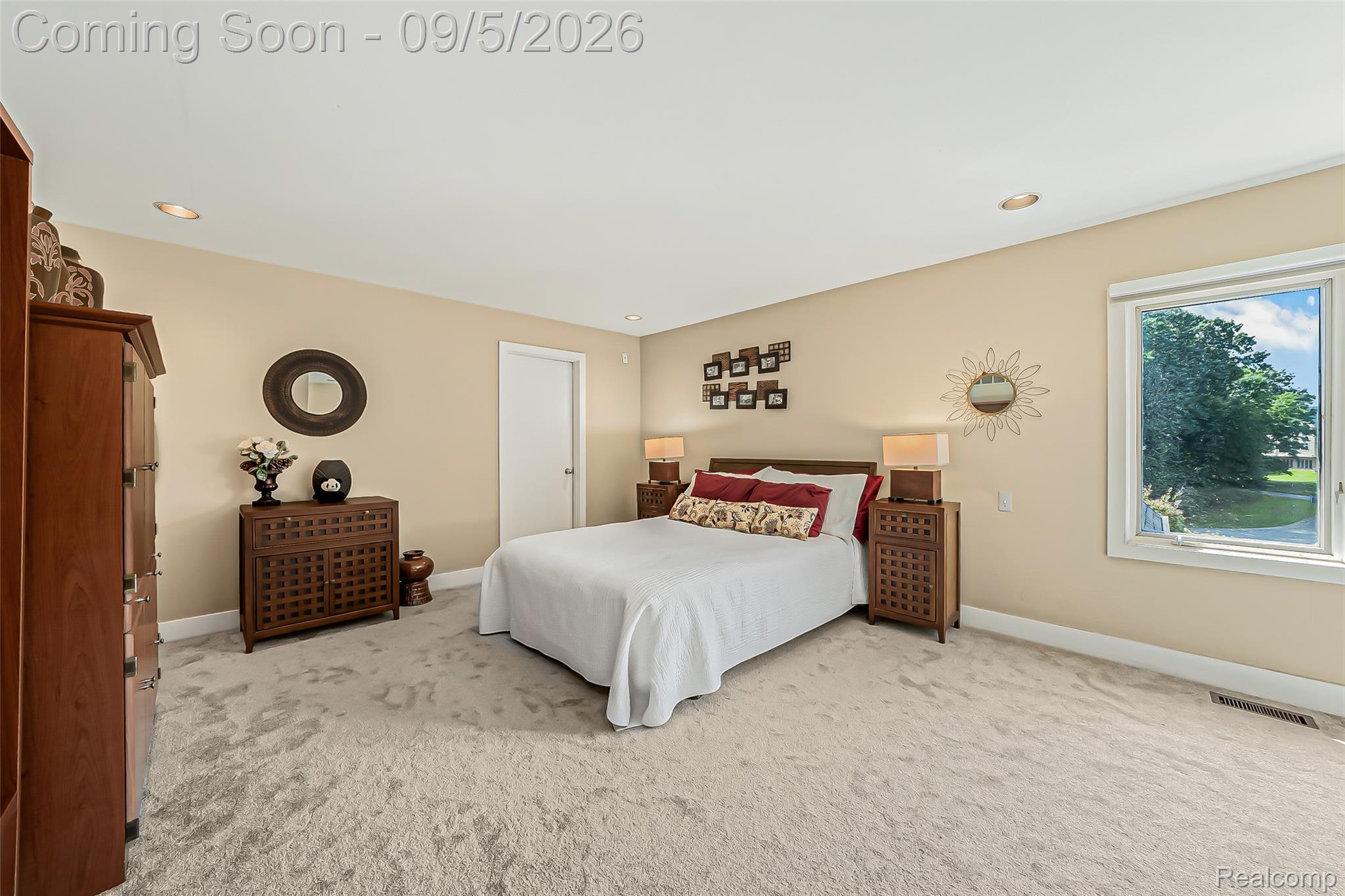 2785 Cranbrook Ridge Court Rochester, MI 48306 - Photo 64 of 97 Neutral-toned wall paint, recessed ceiling lighting, light-colored carpeting, and a white-trimmed window