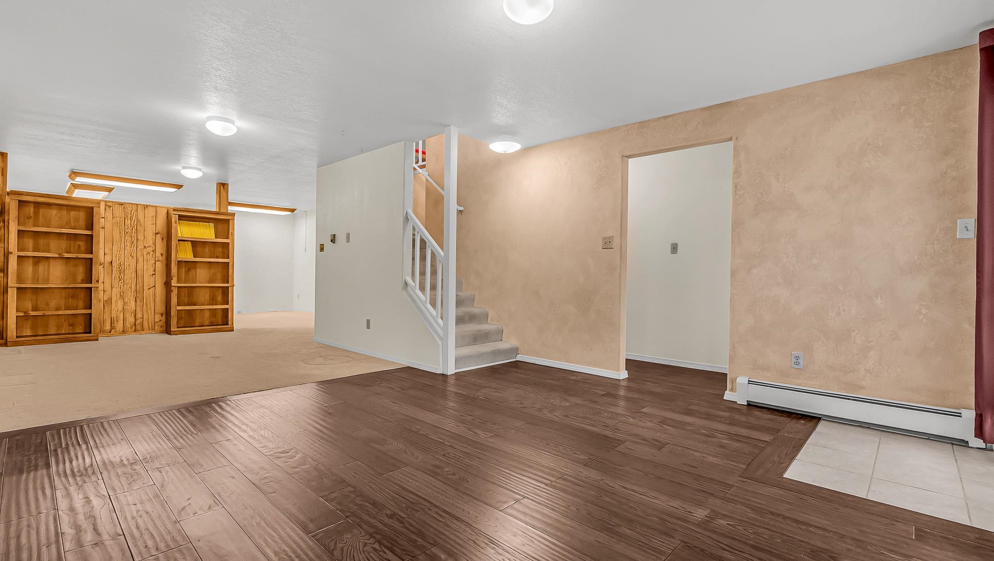 12 West Ridge Court Parachute, CO 81635 - Photo 16 of 37 an empty room with wooden floor and door