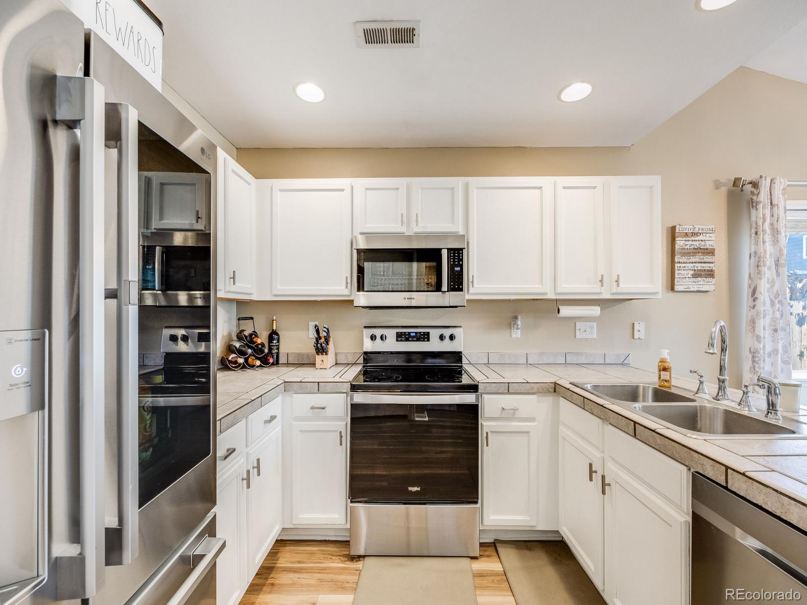 6360 Viewpoint Avenue Firestone, CO 80504 - Photo 12 of 27 a kitchen with a sink stove and microwave