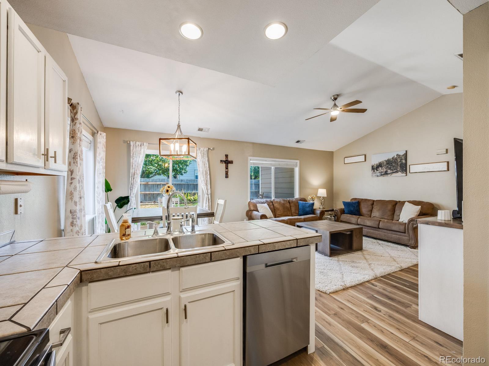 6360 Viewpoint Avenue Firestone, CO 80504 - Photo 13 of 27 a kitchen with a sink and living room view