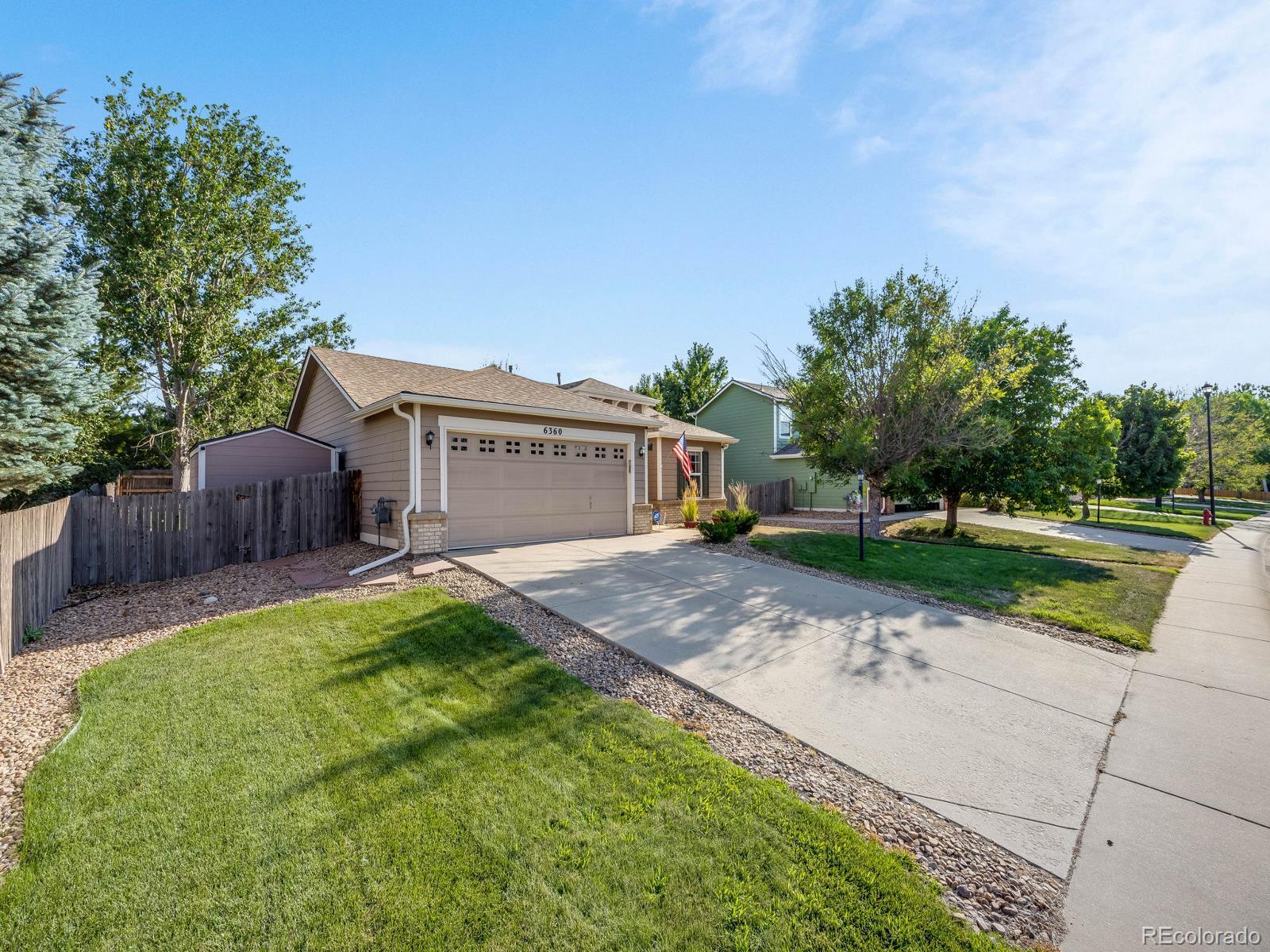 6360 Viewpoint Avenue Firestone, CO 80504 - Photo 2 of 27 a front view of a house with garden