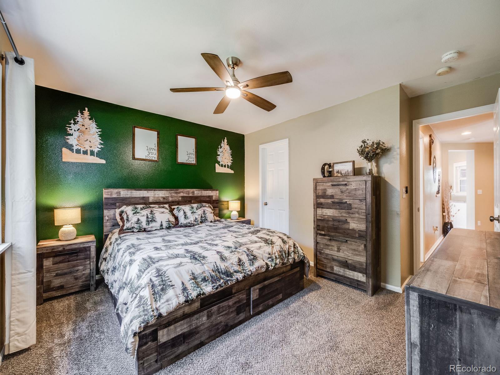 6360 Viewpoint Avenue Firestone, CO 80504 - Photo 21 of 27 a bedroom with a bed dresser and a window