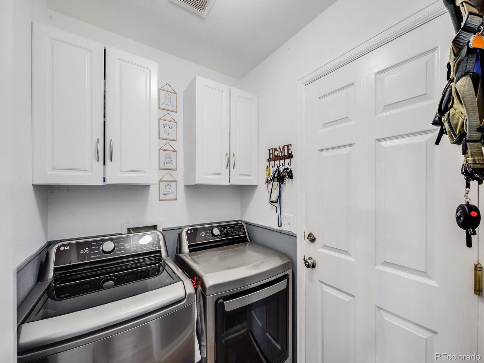 6360 Viewpoint Avenue Firestone, CO 80504 - Photo 24 of 27 a view of a storage and utility room with washer and dryer