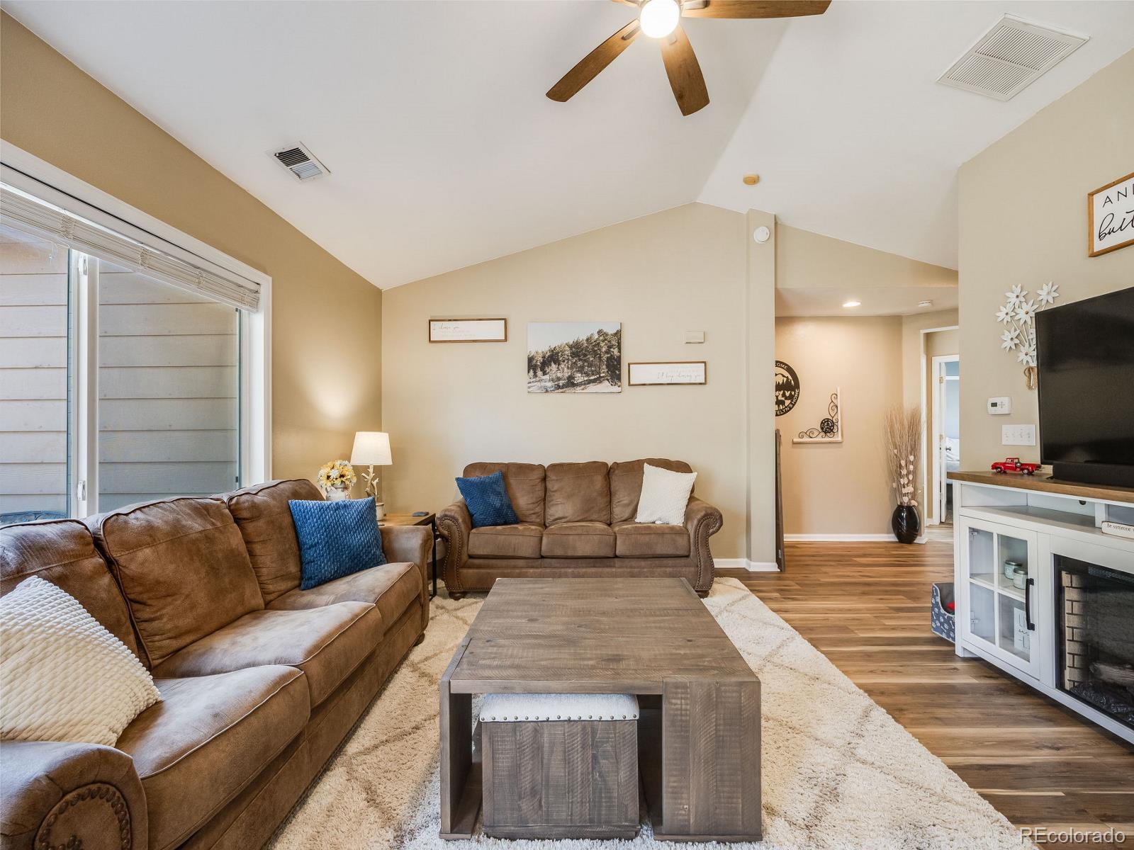 6360 Viewpoint Avenue Firestone, CO 80504 - Photo 9 of 27 a living room with furniture and a flat screen tv