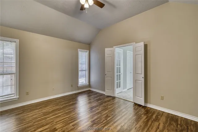 a bathroom with a tub a sink shower and mirror