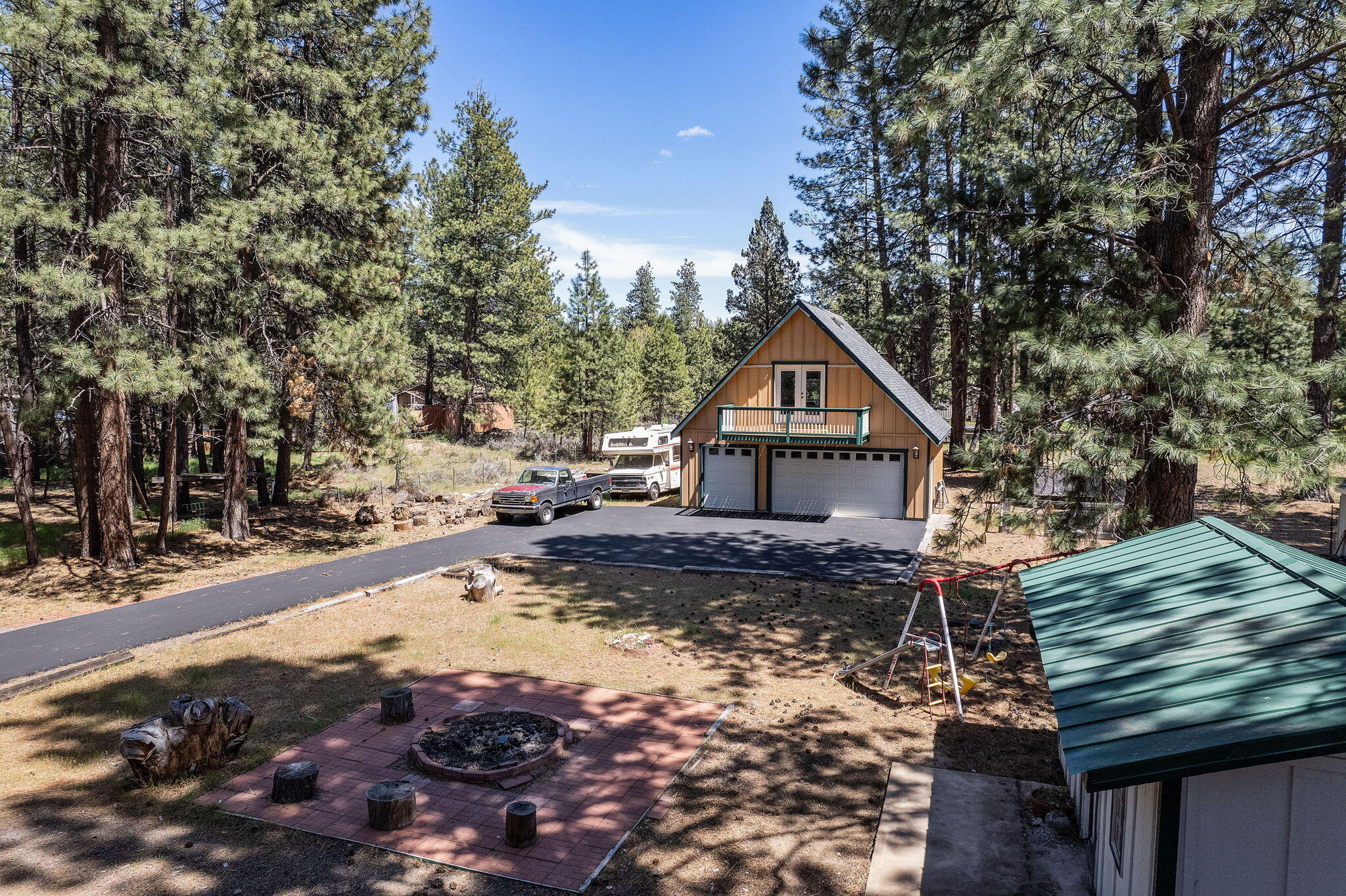59842 Navajo Road Bend, OR 97702 - Photo 41 of 52 a house with trees in the background