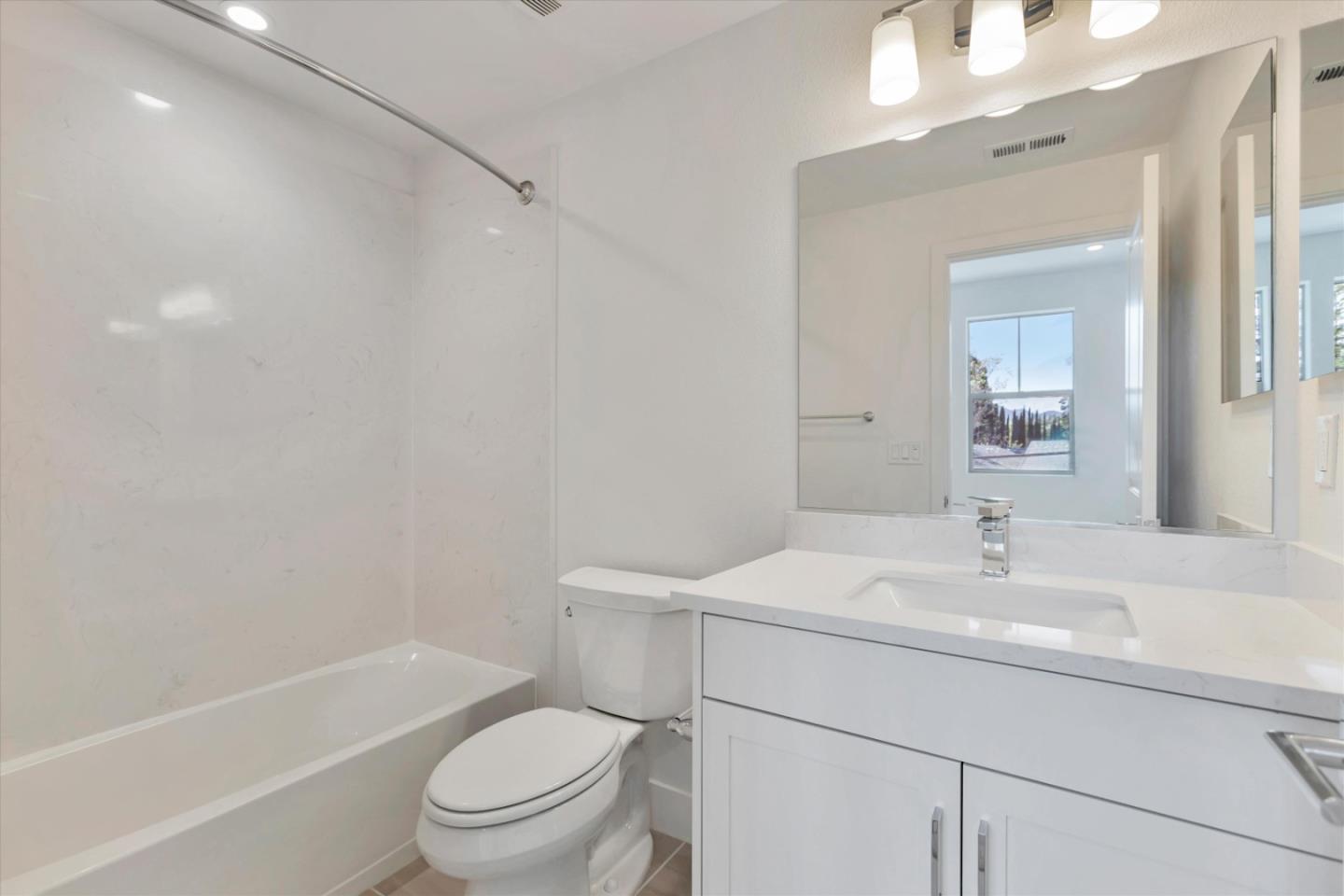 2737 Oak Road Walnut Creek, CA 94597 - Photo 15 of 19 a bathroom with a sink a toilet and shower
