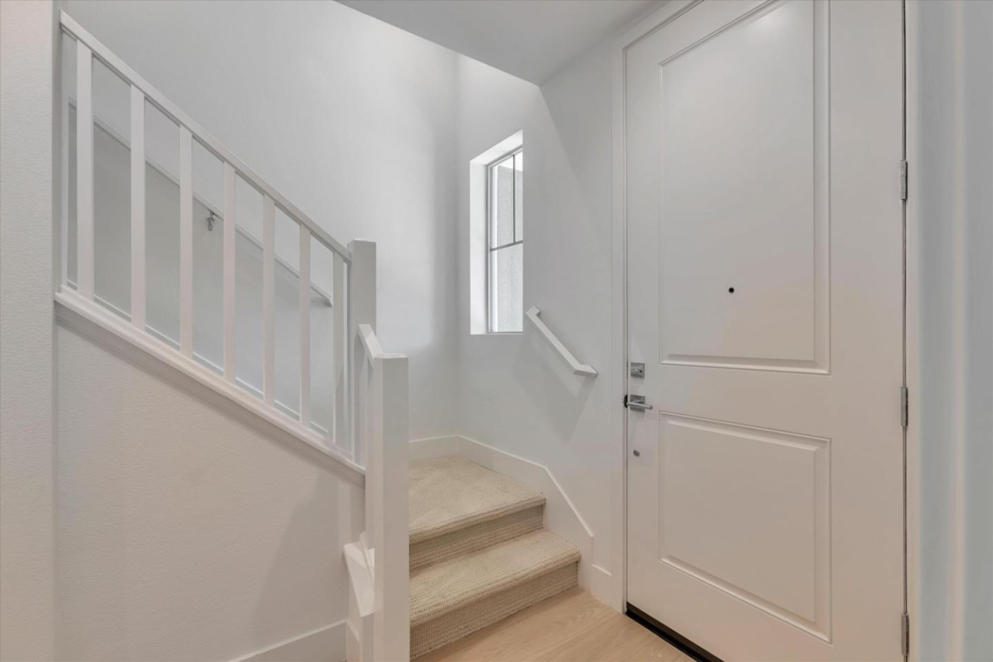 2737 Oak Road Walnut Creek, CA 94597 - Photo 2 of 19 a view of staircase with white walls and white door