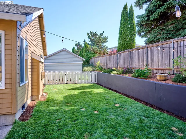 a view of a backyard with plants