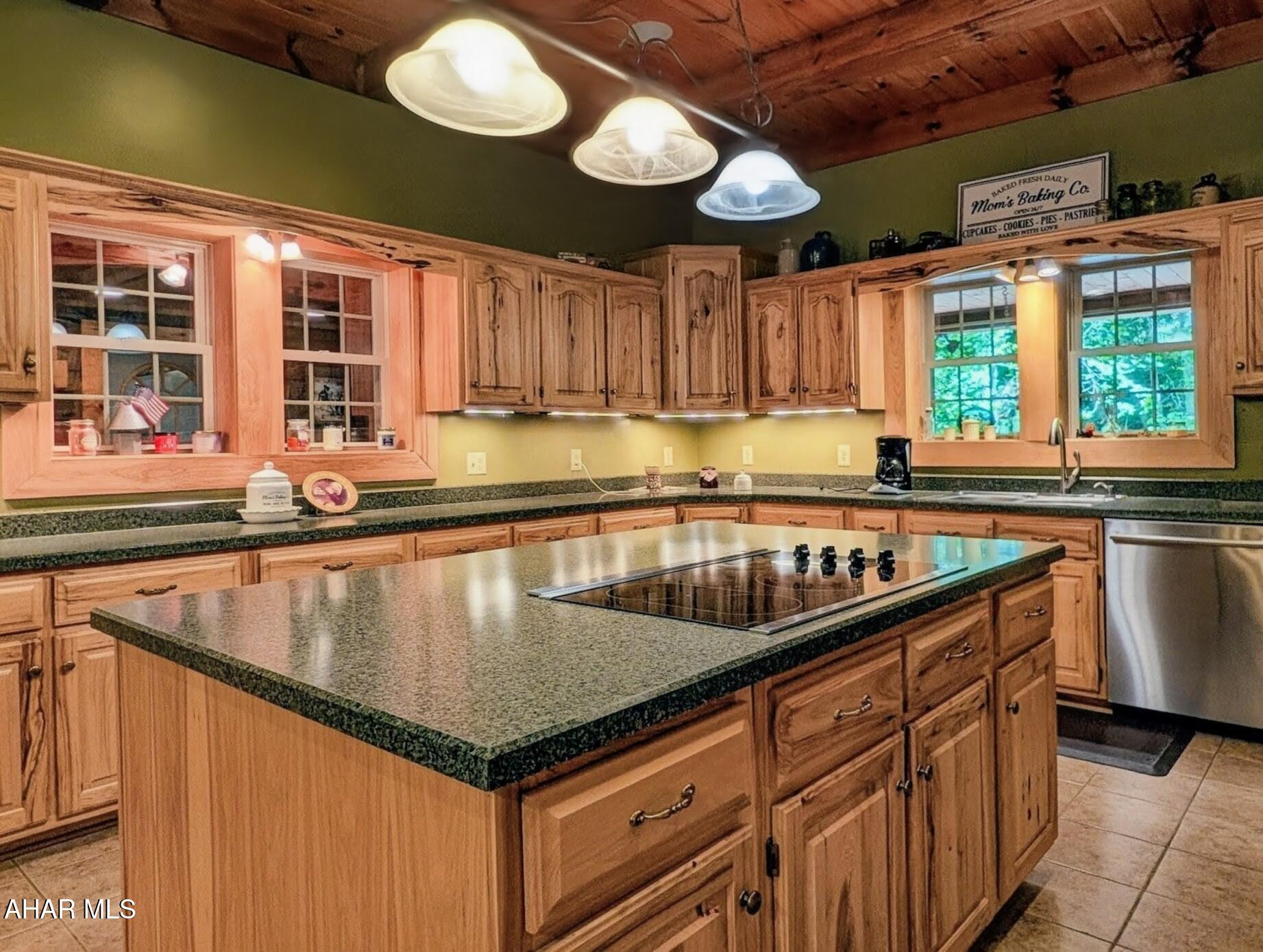 213 Sherman Valley Road Hopewell, PA 16650 - Photo 7 of 104 a kitchen with stainless steel appliances granite countertop a sink a stove and a microwave oven