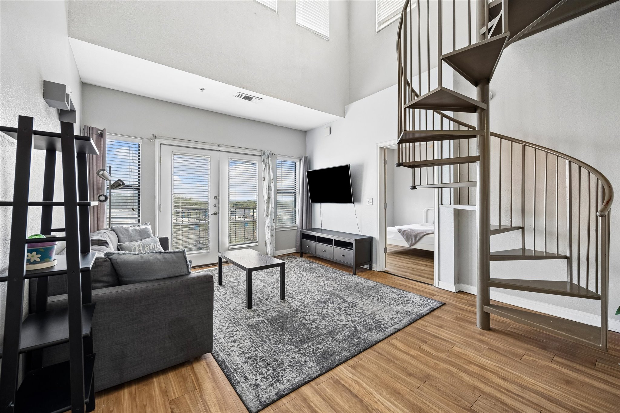 2502 Leon Street, Unit 506 Austin, TX 78705 - Photo 1 of 15 a living room with furniture and a flat screen tv