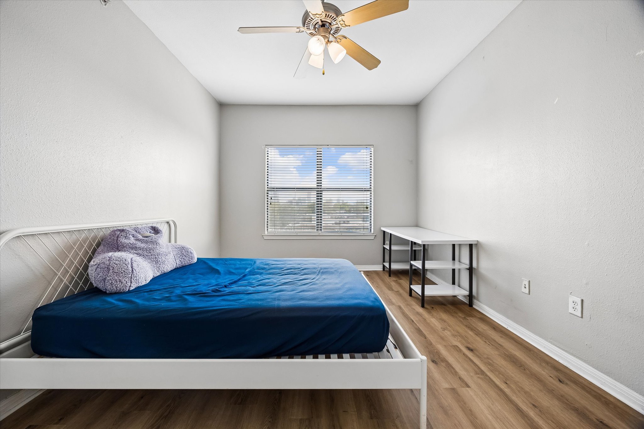 2502 Leon Street, Unit 506 Austin, TX 78705 - Photo 9 of 15 a bedroom with a bed and window