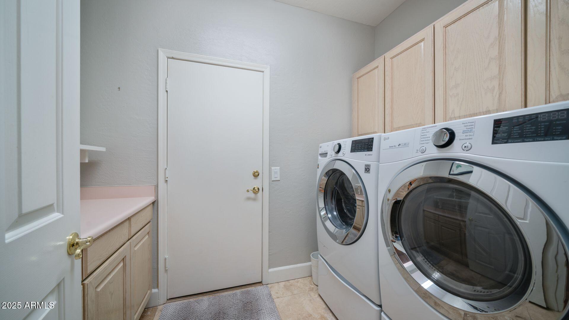 2214 East Beachcomber Drive Gilbert, AZ 85234 - Photo 20 of 45 a utility room with dryer and washer