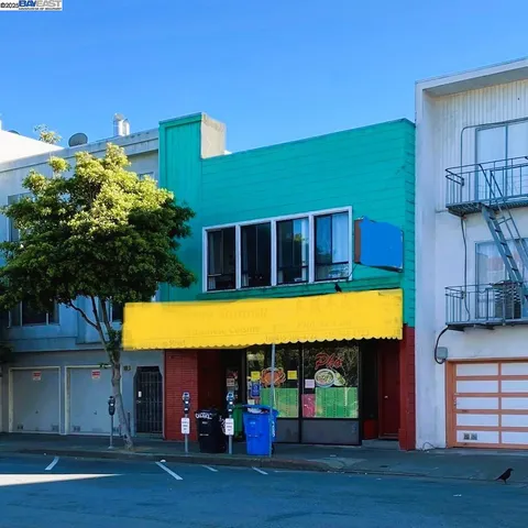 a view of swimming pool with a lawn chairs under an umbrella