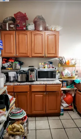 a kitchen with stainless steel appliances a stove a sink and a cabinets