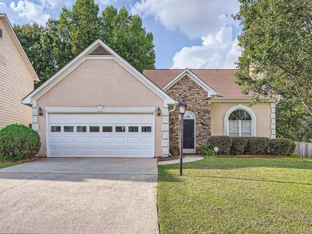 front view of a house with a yard