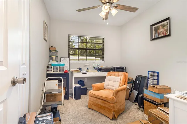 a living room with furniture a piano and a window