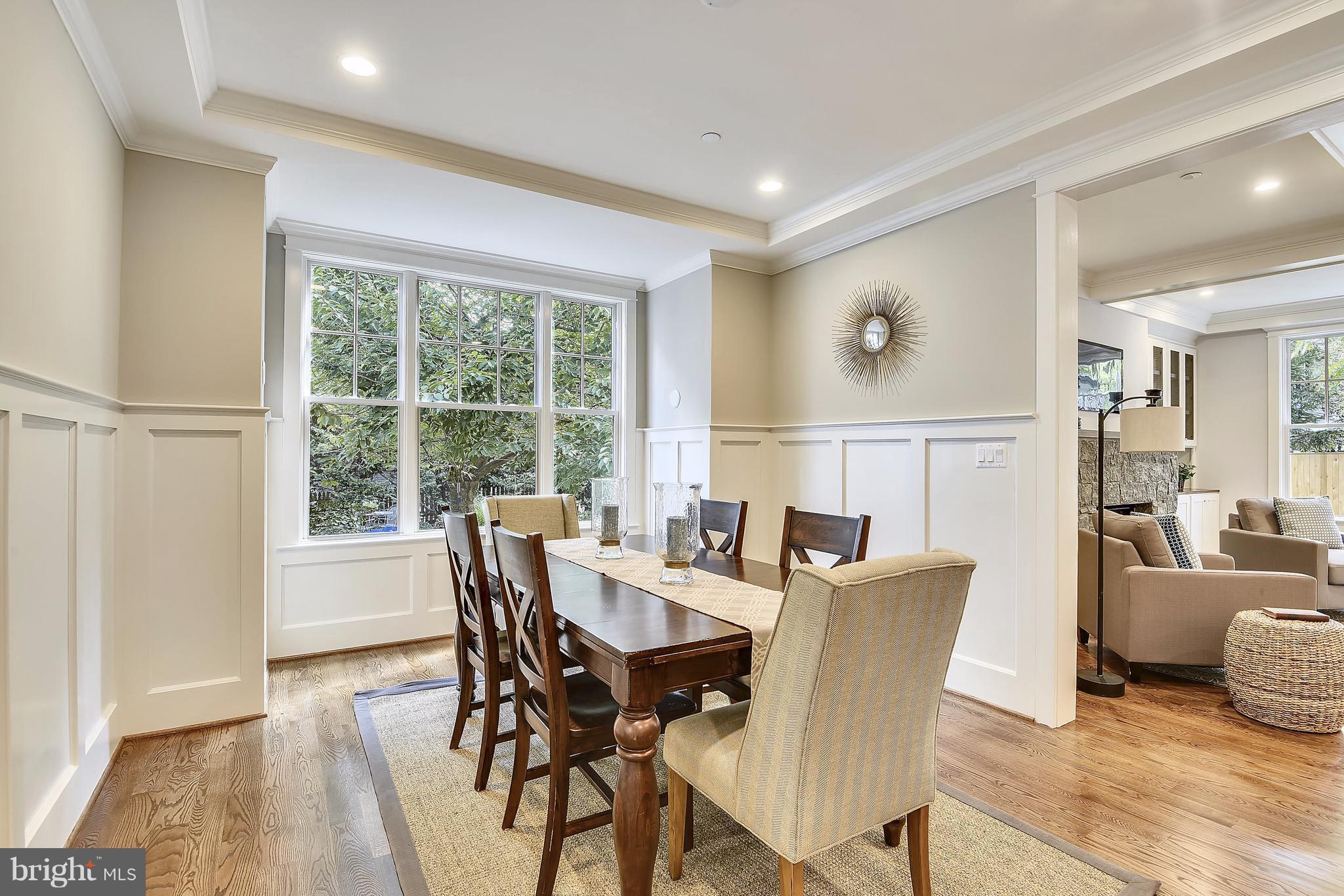 7810 Custer Road Bethesda, MD 20814 - Photo 4 of 30 a view of a dining room with furniture window and wooden floor