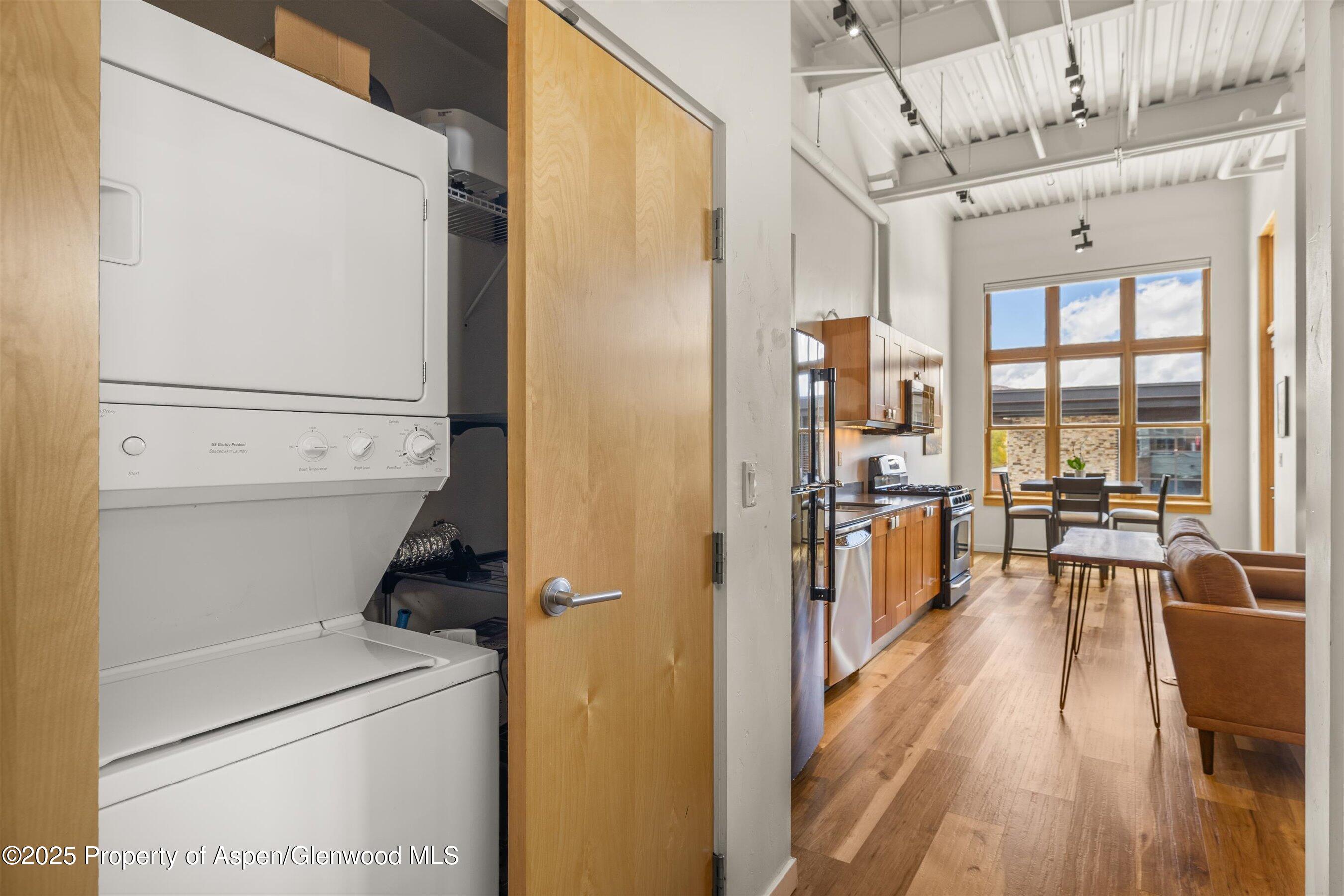 231 Robinson Street, Unit 302 Basalt, CO 81621 - Photo 11 of 17 a view of hallway with furniture and wooden floor