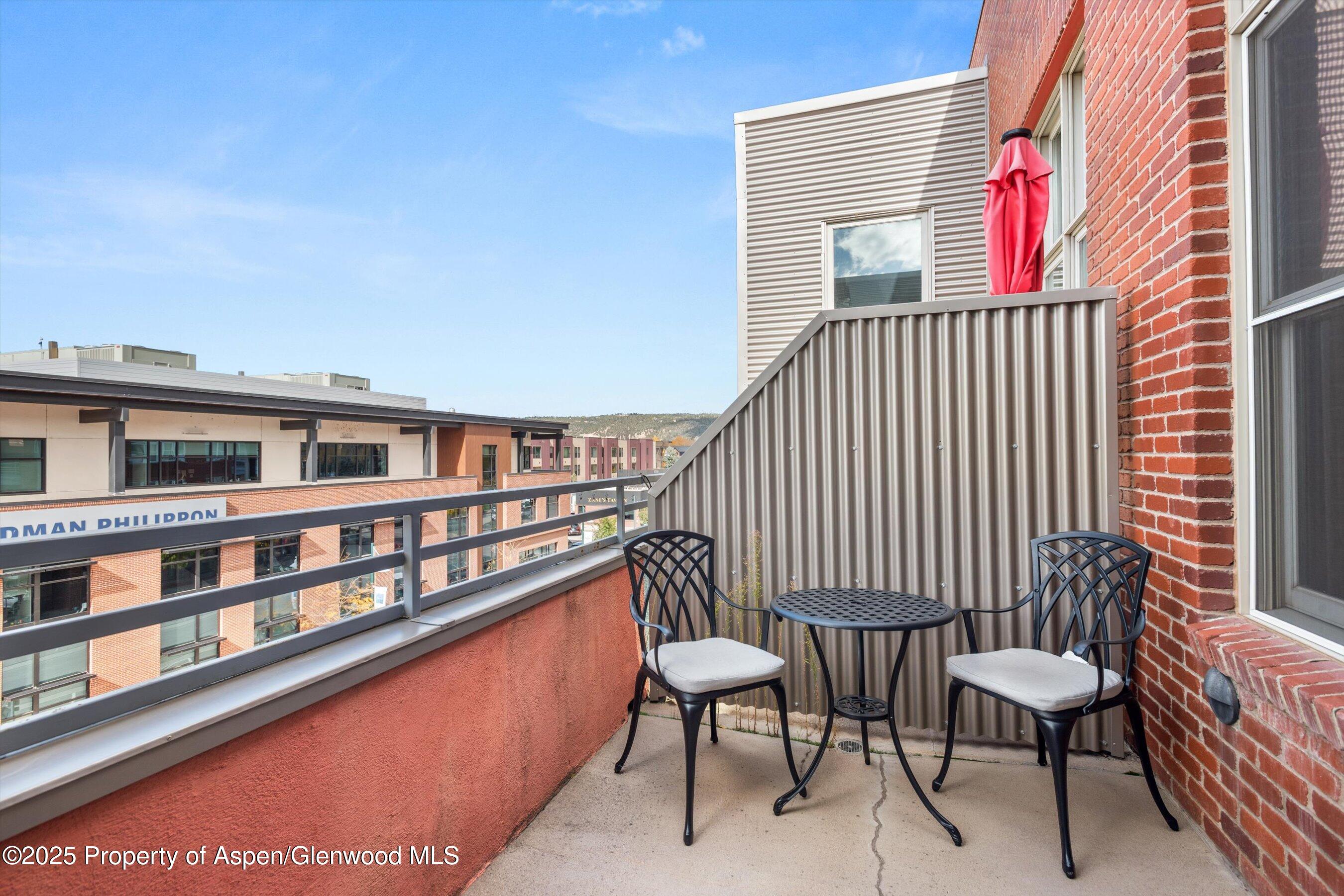 231 Robinson Street, Unit 302 Basalt, CO 81621 - Photo 13 of 17 a balcony with a bench and white walls