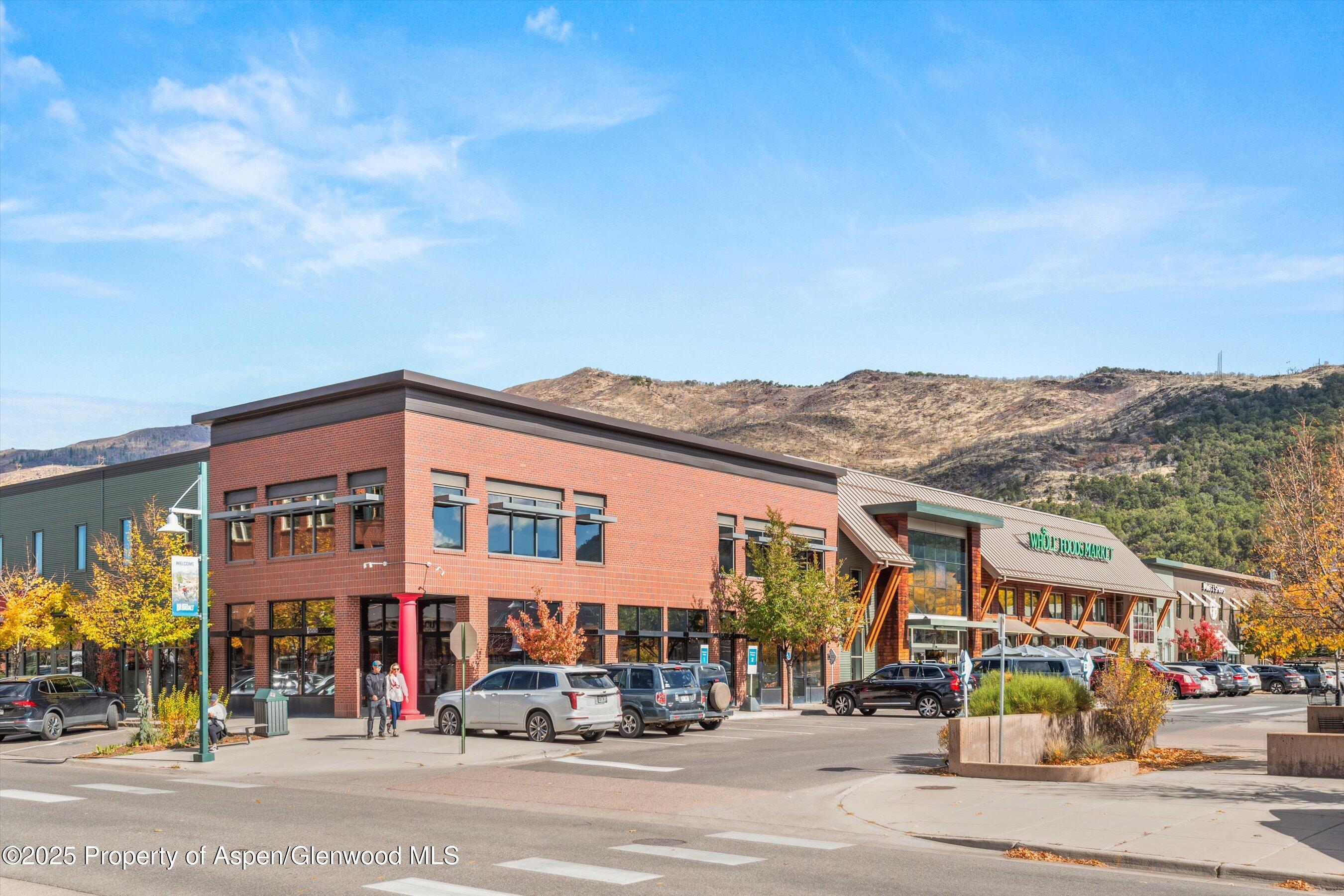 231 Robinson Street, Unit 302 Basalt, CO 81621 - Photo 15 of 17 a front view of a building with street