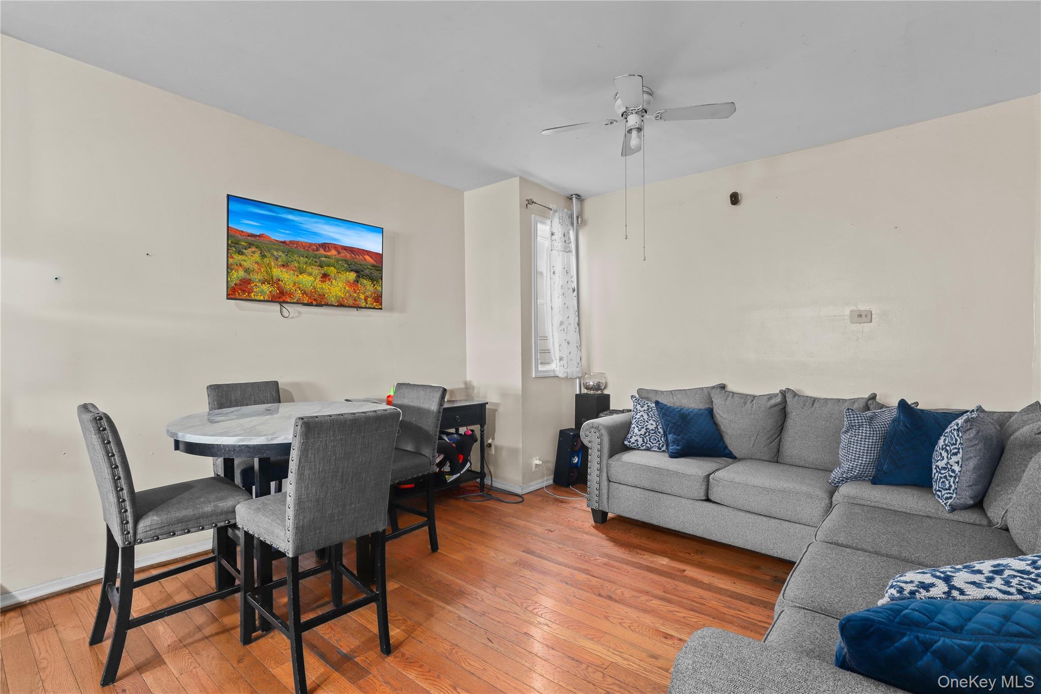 1448 Edwards Avenue Bronx, NY 10461 - Photo 18 of 28 a living room with furniture and a large window