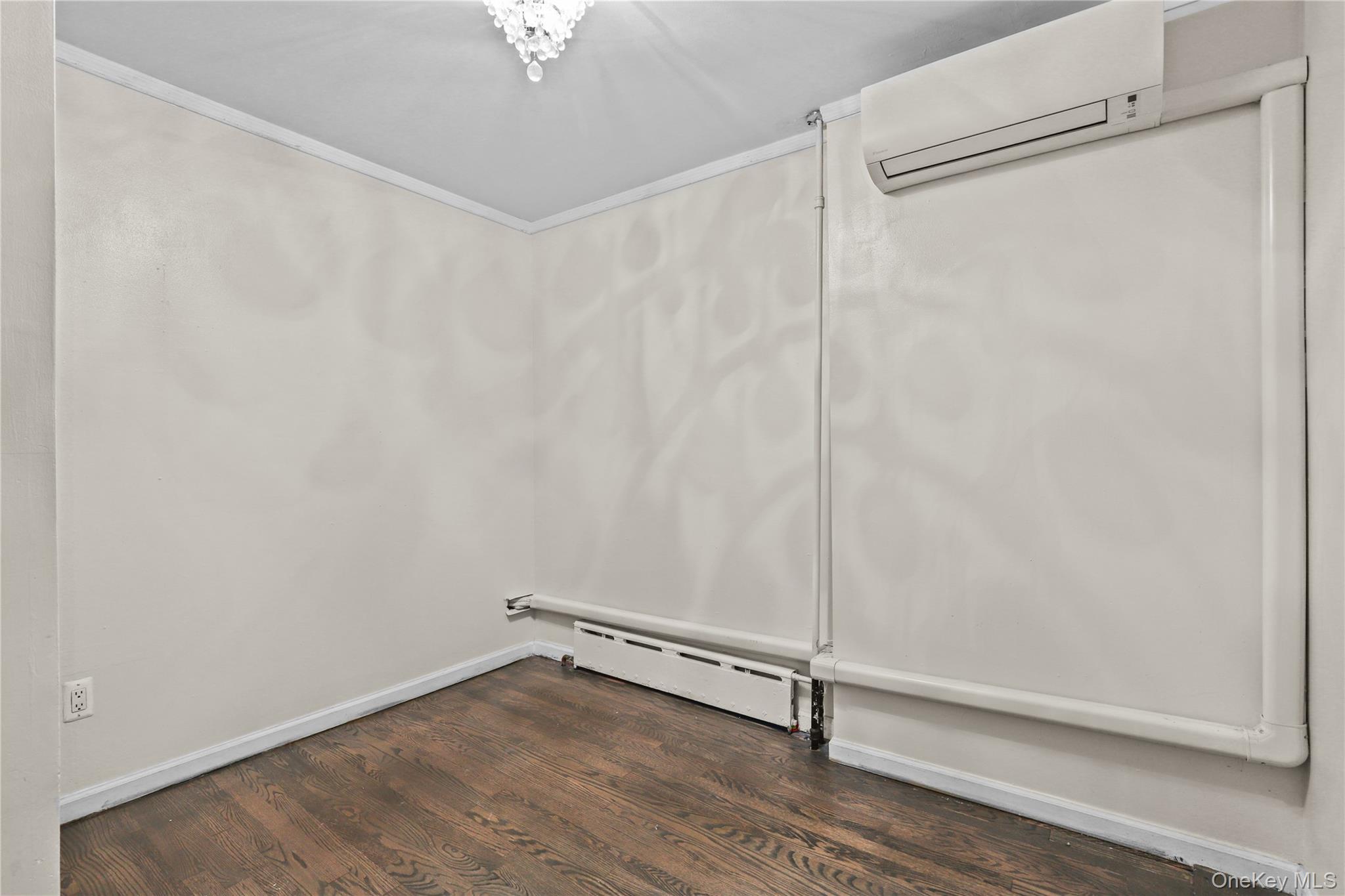 1448 Edwards Avenue Bronx, NY 10461 - Photo 10 of 28 a view of a room with wooden floor and fan