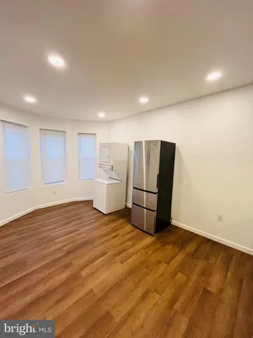 a view of room with refrigerator and microwave