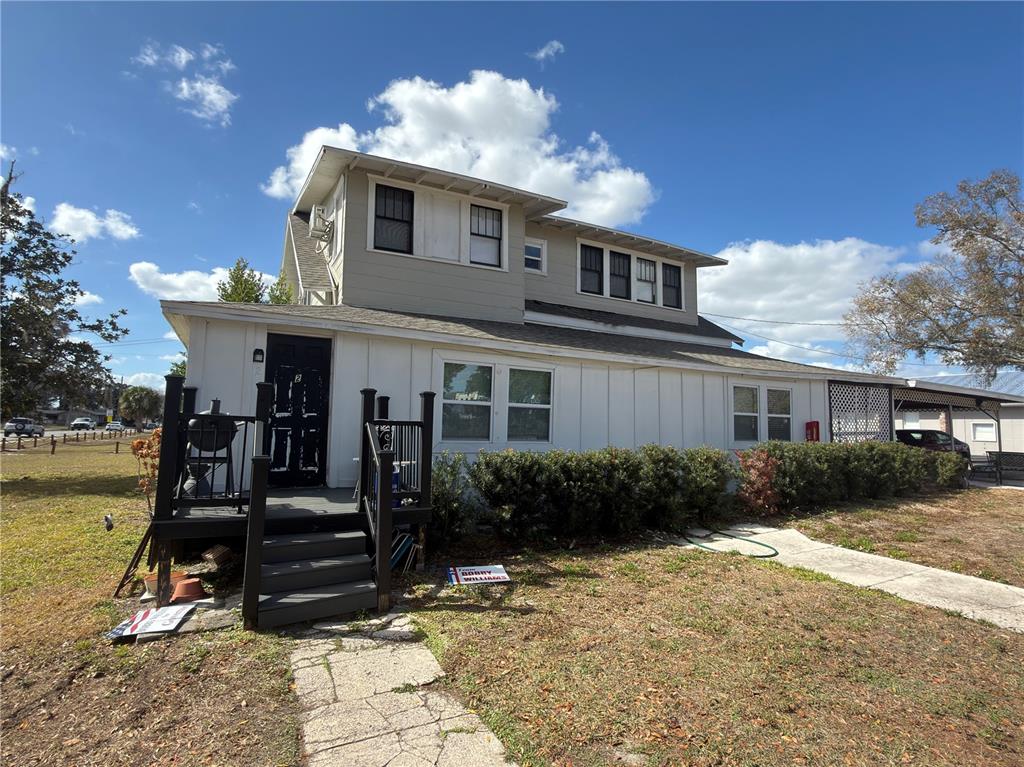 1339 7th Street Southwest Winter Haven, FL 33880 - Photo 2 of 11 a front view of a house with garden