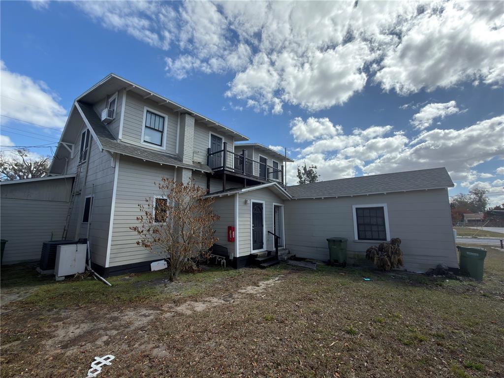 1339 7th Street Southwest Winter Haven, FL 33880 - Photo 4 of 11 a view of a house with a yard