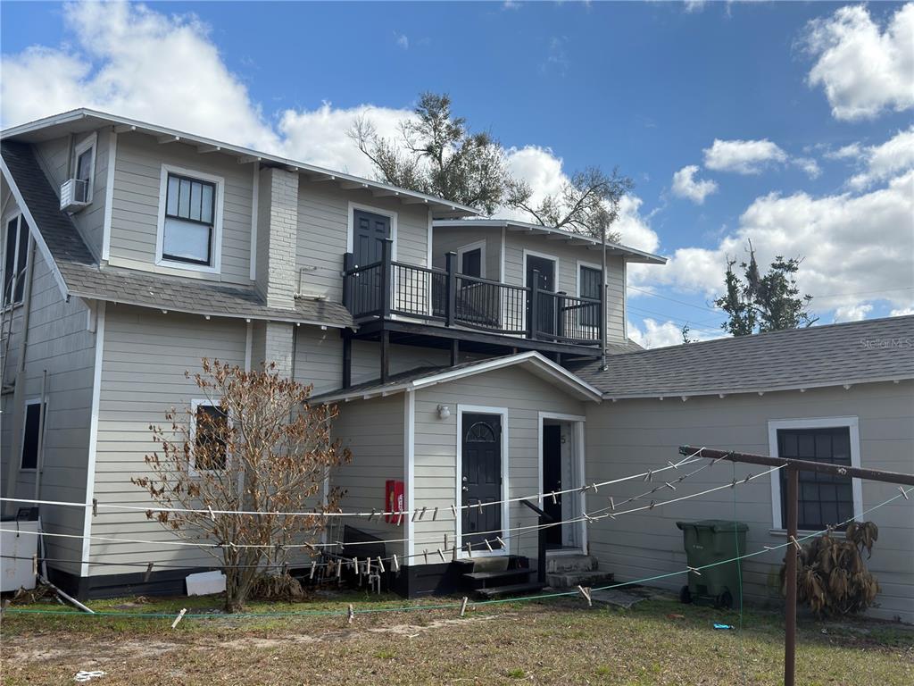1339 7th Street Southwest Winter Haven, FL 33880 - Photo 5 of 11 a front view of a house with a yard