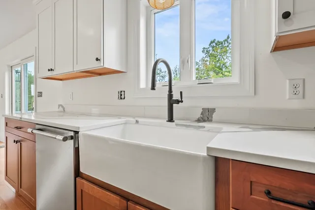 a kitchen with a sink and a window