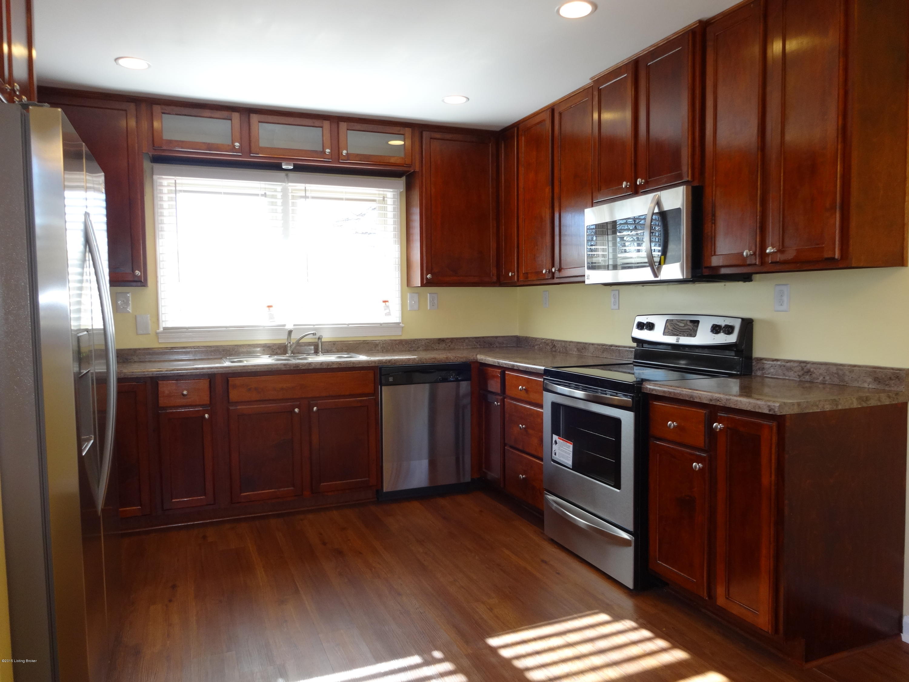 4402 Lowe Road Louisville, KY 40220 - Photo 3 of 44 Updated Kitchen w/ NEW cabinetry, counter tops, lighting, flooring, and NEW APPLIANCE PACKAGE!