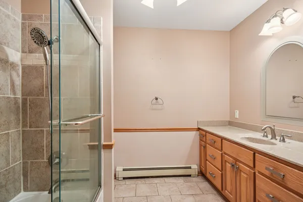 a bathroom with a sink and mirror
